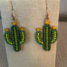 Beaded Gold-Tone Cactus Earrings. French Wire Backs. Never Worn! Casual Dangle Beaded Earrings, Casual Beaded Earrings For Gift, Casual Beaded Earrings For Beach, Casual Green Beaded Earrings For Summer, Casual Green Beaded Earrings For Beach, Green Beaded Fun Earrings, Green Beaded Earrings For Summer Fun, Fun Green Beaded Earrings For Summer, Wire Jigs