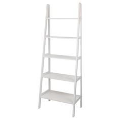 a white ladder shelf with three shelves