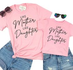 Like Mother Like Daughter Matching Tees! These shirts make the cutest mommy and me matching set and make the perfect gift for any girl mom! To order multiple shirts, simply add each shirt size to your cart one at at time.  Professionally screen printed. Shirt color is Pink. Print color is Black.  ADULT TEES Adult tees are adult unisex sizing. Super soft, made of 100% ring-spun cotton. Fits true to size. Unisex sizing. We recommend ordering the same size you normally wear in an adult unisex shirt Matching Mama And Daughter Outfits, Cute Summer T-shirt For Parenting, Pink Short Sleeve T-shirt For Family, Mommy And Me Shirts Daughters, Family Matching Pink T-shirt With Letter Print, Pink Family Matching T-shirt With Letter Print, Pink Cotton Family Matching T-shirt, Pink Cotton T-shirt For Mother's Day, Pink Tops With Funny Print For Mother's Day