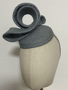 When you buy a Fascinator made from Toquilla Straw, you don't just buy a Fascinator, you buy a piece of art. This genuine Panama hat is woven in Ecuador by Ecuadorian Artisans. Colour & Dimensions: ---------------------- Classic Colour Grey Design: Rosy Shape: Blocked using the small  wooden block high quality Elastic band inside  It is made from 100% toquilla straw, the same fiber used to make the very famous Panama Hat.   Be aware this hat is made from natural fibers, therefore, you must store Adjustable Woven Hat With Structured Crown, Adjustable Pinched Crown Summer Headband, Adjustable Pinched Crown Headband For Summer, Handmade Fascinator For Kentucky Derby With Structured Crown, Handmade Kentucky Derby Fascinator With Structured Crown, Handmade Structured Crown Fascinator For Kentucky Derby, Handmade Fascinator On Headband, Handmade Fascinator With Structured Crown, Handmade Fitted Fascinator With Structured Crown