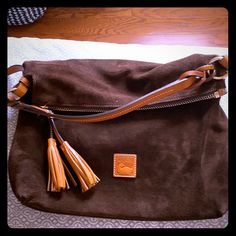 Dark Brown Suede Bag With Braided Leather Shoulder Strap. Leather Tassel Pull. Key Fob Finder Inside Bag. Large Zipper Interior Pocket With 3 More. Dooney Bourke Handbags Hobo Shoulder Bags, Brown Suede Bag, Suede Bag, Hobo Shoulder Bag, Inside Bag, Dooney & Bourke Bags, Leather Tassel, Braided Leather, Key Fob