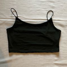 Spaghetti Strap Crop Top Size: Medium Color: Black Top Never Worn. Does Not Have Tags. Excellent Condition. Carefully Look At All The Pictures For Full Description! Black Crop Top Spaghetti Straps, Black Summer Tops With Built-in Bra, Black Tank Crop Top With Built-in Bra, Black Cami Top With Built-in Bra, Black Stretch Camisole For Summer, Black Stretch Crop Top With Adjustable Straps, Basic Black Sleeveless Camisole, Basic Black Tops With Built-in Bra, Black Spring Tank Top With Straps