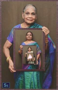 an old woman holding up a framed photo