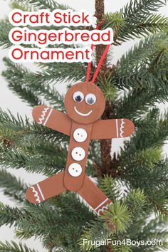 a gingerbread ornament hanging from a christmas tree with the words craft stick gingerbread ornament on it