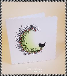 a card with a bird sitting on top of it