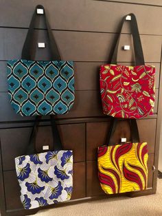 100% African wax cotton  Lined with black felt Large inside pocket  Black fabric straps  14x14 Ankara Tote Bag, African Gifts, Canvas Bag Design, African Bag, Fabric Tote Bag, Fabric Tote Bags, Fabric Tote, Crossbody Tote Bag, Teacher Appreciation Gift