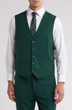 Bring understated elegance to the table in this three-piece suit crafted from rich fabric in a classic single-breasted silhouette. Jacket has notched lapels; chest welt pocket; front flap pockets Vest has front button closure; V-neck Pants have zip fly with button closure; front slant pockets; back button-welt pockets Jacket and vest are lined; trousers are lined to the knee 65% polyester, 35% viscose Dry clean Imported Each suit has a 6” drop, meaning that a size 38R jacket is paired with size Semi-formal Single-breasted Vest With Lapel Collar, Classic Lapel Collar Vest For Workwear, Classic Vest With Lapel Collar For Workwear, Formal Sleeveless Blazer With Button Closure, Tailored Single Button Vest For Semi-formal Occasions, Three-piece Suit With Button Closure For Work, Formal Vest With Notch Lapel And Button Closure, Classic Lapel Collar Vest For Business Casual, Tailored Vest With Notch Lapel And Button Closure