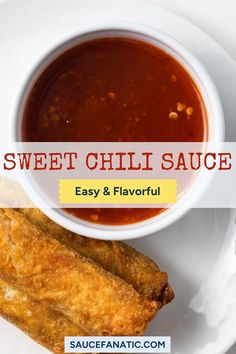 sweet chili sauce in a white bowl next to two fried fish sticks on a plate