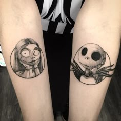 two people with tattoos on their legs, one has a skull and the other has a skeleton