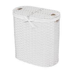 a white wicker laundry basket with two handles on the front and bottom, tied in a bow