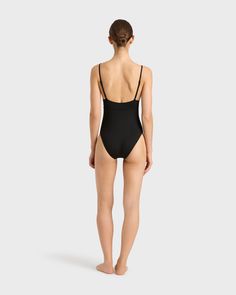 The Emilia One Piece in Black is a classic and elegant swimsuit featuring a triangle bra, adjustable rouleau straps, under-bust support and a medium to high leg line with regular bottom coverage. Emilia is made from our unique Singuleur® fabric that moves with the body like a second skin. Luxury fabric sustainably made in Italy. Garment ethically and sustainably made in Australia. Elegant Swimsuit, Classic Swimsuit, Luxury Fabric, Triangle Bra, Halter Maxi Dresses, Designer Swimwear, Organic Linens, Dress Cover, Australian Fashion