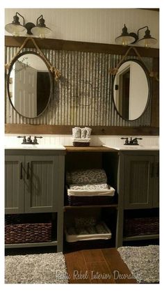 a bathroom with two sinks and mirrors above the sink, along with baskets on the floor