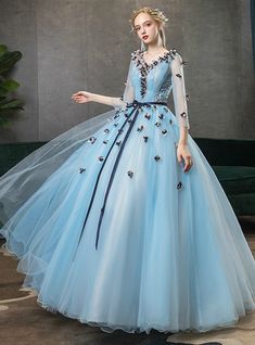 Silhouette:ball gownHemline:floor lengthNeckline:v-neckFabric:tulleShown Color:blueSleeve Style:3/4 sleeveBack Style:lace upEmbellishment:appliquesBuilt-in Bra: yes Long Sleeve Quinceanera Dresses, Dresses Sweet 16, Short Sleeve Prom Dresses, Dresses 15, Pretty Products, Dresses Quince, One Shoulder Prom Dress, Couture Gown, Bridal Elegance