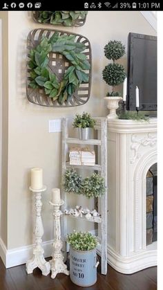 a living room filled with furniture and a tv on top of a fireplace mantel