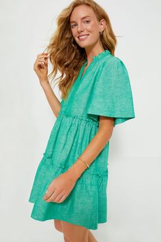 The Sea Green Crawford Dress is exactly what we have been searching for — that perfect warm weather piece that you can throw on for morning cappuccinos and wear until cocktail hour. Featuring oversized flutter sleeves, ruffle detailing on the neckline and skirt, and a swing silhouette in a vibrant shade, this mini is the most flattering and flirty frock. Effortlessly whisking you from work to play, pair with sneakers and sunnies for a casual look then switch to wedges and statement earrings for Casual Tiered Dress With Flutter Sleeves, Summer Ruffle Dress With Short Sleeves For Vacation, Short Sleeve Summer Ruffle Dress For Vacation, Casual Tiered Ruffle Sleeve Dress For Vacation, Casual Tiered Dress With Ruffle Sleeves For Vacation, Green Ruffle Sleeve Dress For Beach, Green Tiered Dress With Ruffle Hem For Vacation, Short Sleeve Ruffle Hem Dress For Beach, Short Sleeve Tiered Ruffle Dress For Beach