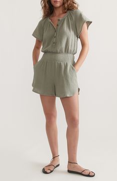 Gauzy, lightweight double-cloth cotton lends breezy style to this short-sleeve romper shaped by smocking at the waist. Button half placket Band collar Short sleeves Front slant pockets Smocked waist 100% cotton Hand wash, dry flat Imported Casual Jumpsuits And Rompers With Short Sleeve, Relaxed Fit, Casual Short Sleeve Jumpsuits And Rompers With Relaxed Fit, Casual Short Sleeve Relaxed Fit Jumpsuits And Rompers, Summer Short Sleeve Jumpsuits And Rompers With Button Closure, Summer Daywear Short Sleeve Jumpsuits And Rompers, Short Sleeve Cotton Jumpsuits And Rompers For The Beach, Summer Daywear Jumpsuits And Rompers With Short Sleeves, Cotton Short Sleeve Jumpsuits And Rompers For Beach, Summer Jumpsuits And Rompers With Short Sleeves Relaxed Fit