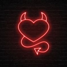 a neon devil heart with an arrow in the middle on a dark brick wall background