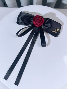 This price is for a brooch only, others are not included.   	 		 			Size 			Free Size 		 		 			Length 			19 		 		 			Width 			13 Elegant Flower Hair Accessories For Gift, Black Brooch With Decorative Bow Gift, Black Brooch With Decorative Bow As Gift, Black Ribbon Brooches As Gift, Black Ribbon Brooches For Gift, Formal Flower Lapel Pin, Formal Hair Accessories With Bow, Elegant Red Pins For Party, Elegant Red Party Pins