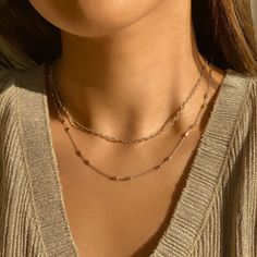 Achieve a trendy layered choker look with this minimalist layered duo. Consisting of two Sterling Silver necklaces, mix and match with our patented design. Marina Chain Italian Anchor chain, width 2.2mm Adjustable chain: 13-16in (33-40cm), 15-18in (38-46cm) Deux Chain Italian chain, width 2.2mm Adjustable chain: 13-16in (33-40cm), 15-18in (38-46cm) .925 Sterling Silver Cubic Zirconia Hypoallergenic, lead and nickel free #029S-030S Italian Chain, Layered Chokers, Anchor Chain, Layered Necklace Set, Choker Necklace Set, Multi Strand Necklace, Strand Necklace, Multi Strand, Mix And Match