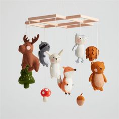 a group of stuffed animals hanging from strings