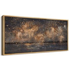 fireworks are lit up in the night sky over water with reflections on the water below