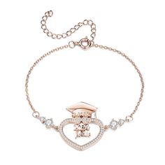 a bracelet with a heart shaped charm and an anchor on the clasp, in rose gold tone