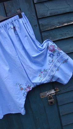 This is a pair of my harem/wide legged bloomers/pants. LISTING IS FOR PANTS ONLY XXXX These beauties have been fashioned from a vintage cotton embroidered tablecloth. These have been dyed to this fabulous and eye catching cornflower blue! The colour alone, I feel, makes these extra special but with the added embroidery and crochet work, these are amazing! These have a deep elasticated waistband for comfort and easy pull on style! A simple pull on style, freshly laundered and ready to wear.. Thes Blue Floral Embroidered Wide Leg Bottoms, Blue Bohemian Embroidered Pants, Bohemian Blue Embroidered Pants, Blue Cotton Bottoms With Embroidered Hem, Blue Floral Embroidered Pants For Summer, Spring Blue Cotton Bloomers, Embroidered Cotton Bottoms For Daywear, Vintage Blue Summer Pants, Bloomers Pants