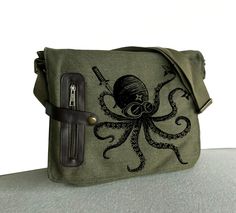 My latest " Ninja Octopus" Design on the Bag Each Bag was hand screen printed by me, so each bag is a little bet different. You might get slightly different from picture. * Dimensions:12"h x 15"w (middle) 12' (bottom) x 3.5"d  * 100% pigment-dyed, garment-washed cotton canvas * two large back exterior pockets (Kindle can fit in) * interior one big zippered pocket , 2 small pockets Steampunk Ninja, Messanger Bag, Octopus Design, Small Laptop, Fish In A Bag, Vintage Fishing, Hand Screen Printed, Messenger Bag Backpack, Khaki Green