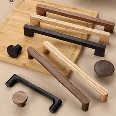 various wooden handles and knobs on a cutting board