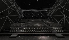 an empty auditorium with rows of seats and stars in the sky