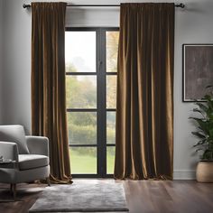 a living room with a chair and window covered in brown drapes, along with a rug on the floor