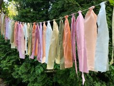 several different colored ribbons hanging from a line