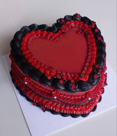 a heart shaped cake sitting on top of a piece of paper