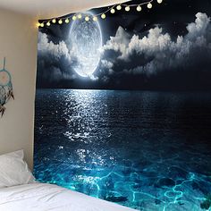 an ocean scene with the moon and stars in the sky