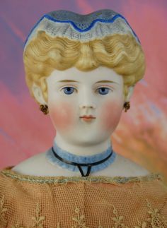 a doll with blonde hair and blue eyes