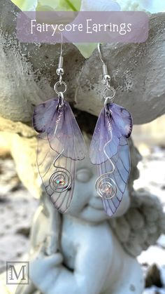 Pale pink double wing butterfly wing earrings with wired  pink crystal with fairy ornament in background Pink Fairycore, Fairycore Earrings, Fairy Wing Earrings, Fairycore Coquette, Shrinky Dink, Coquette Cottagecore, Glitter Top, Wings Design, Plastic Crafts