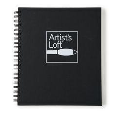 a black notebook with the words artist's loft written in white and on it