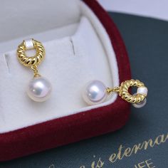 Indulge in luxurious elegance with our 9-10mm Gold Twist Pearl Earrings. The lustrous, sizable pearls showcase a captivating twist design, adding a modern and sophisticated flair. Crafted with meticulous attention to detail, these earrings effortlessly elevate any ensemble, making them a must-have for those who appreciate timeless beauty with a contemporary twist. Material: Freshwater Pearl with 925 sterling silver Product Information Pearl Type Freshwater Pearl Origin China Shape Round Quality Luxury Pearl Earrings With Pearl Pendant, Luxury Pearl Pendant Earrings, Luxury Pearl White Drop Earrings, Luxury Pearl White Pearl Earrings, Luxury Pearl White Earrings With Pearl Pendant, Luxury Pearl Pendant Earrings For Gift, Luxury White Diamond Pearl Earrings, Luxury Baroque Pearl Earrings, Twist Earrings