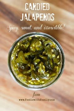 pickles in a glass jar on a wooden table top, ready to be eaten