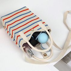 Experience the ultimate versatility with our Colorful Striped Lightweight Shoulder Bag. Perfect for all seasons, this bag features bold and trendy stripes, providing a pop of color to any outfit. The lightweight material makes it easy to carry, making it your perfect companion wherever you go. Color : White Magnetic : No Bag Size : Mini Style : Casual Type : Crochet Bags Closure Type : Buckle Strap Type : Double Handle, Top Handle Pattern Type : Striped Features : Lightweight, Foldable Compositi Travel Shoulder Bag With Striped Lining, Striped Travel Bags With Adjustable Strap, Casual Multicolor Canvas Shopping Bag, Summer Rectangular Bag With Striped Lining, Summer Travel Shoulder Bag With Striped Lining, Summer Rectangular Shoulder Bag With Striped Lining, Beige Tote Shoulder Bag With Striped Lining, Summer Striped Shoulder Bag For Everyday, Travel Bags With Striped Lining