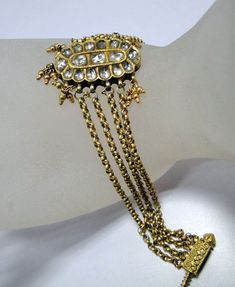 Vintage 22K Gold Polki Diamond set Bracelet From Rajasthan India. Beautiful Collection piece in good Condition. Length-18 cm( 7") we can adjust length, size of center piece-2.8/2 cm , Weight-22 grams. Kundan Bracelet, Diamond Cuff Bracelet, Gold Link Chain, Jewelry Bracelets Gold, Vintage Bangles, Cuff Jewelry, Bangles Jewelry Designs, Gold Bead Bracelets, Gold Link