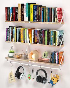 a book shelf with headphones and books on it