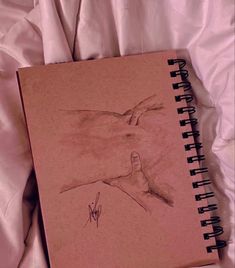 a book with a drawing of a hand on it