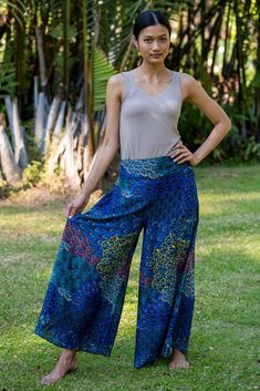 Breezy, comfortable and super easy to combine with your favorite tops.  What's not to love about these Thai Palazzo Pants? The fabric is printed with a mesmerising layered floral pattern which shimmer as the pants move. High-waisted and wide-legged they will suit most figures and are made to be worn as full length pants.  To make these pants more comfortable, elastic has been used on the rear of the waistband, giving you the chance to show off the top of the pants without the smoc Thai Pants, Fisherman Pants, Full Length Pants, Printed Palazzo Pants, Hippie Pants, Palazzo Pants, Star Designs, Fashion Magazine, Super Easy