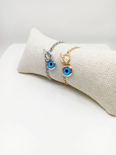 Blue eye jewelry is tarnish resistant,can't be faded in a long time. The lenght of the nazar bracelet is 18 cm(7 in) Evil eyes are believed to protect the person who carries them. They are also believed to bring good luck and deflect the negative energy. Evil eye charm bracelet can be a perfect gift choice for Christmas or birthday. 🌀Evil eye charm is over 5000 years old. It is found in all major religions and cultures. Blue evil eye or lucky evil eye is a Mediterranean amulet for protection ag Metal Charm Bracelet With Evil Eye, Evil Eye Metal Charm Bracelet, Blue Metal Spiritual Bracelets, Spiritual Blue Metal Bracelets, Blue Evil Eye Bracelet With Adjustable Chain, Blue Metal Bracelets With Evil Eye, Blue Metal Bracelet With Evil Eye, Blue Evil Eye Bracelet Gift, Blue Charm Bracelet With Adjustable Chain