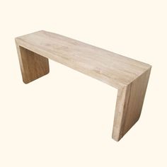 a wooden bench sitting on top of a white floor