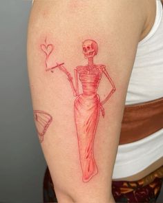 a woman with a skeleton tattoo on her arm