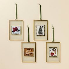 four framed christmas cards hanging on a wall