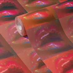 a roll of pink and orange holographic paper with lipstick on it's lips