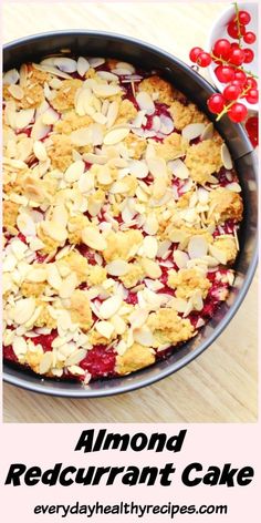 an image of a baked dessert with cherries on top and the words almond red curran cake above it